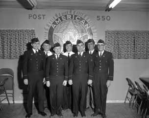 Seven members of the Legion pose in full regalia.