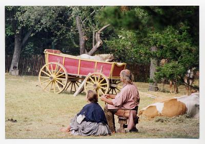 Wagon and settlers reenact bygone days in the park.